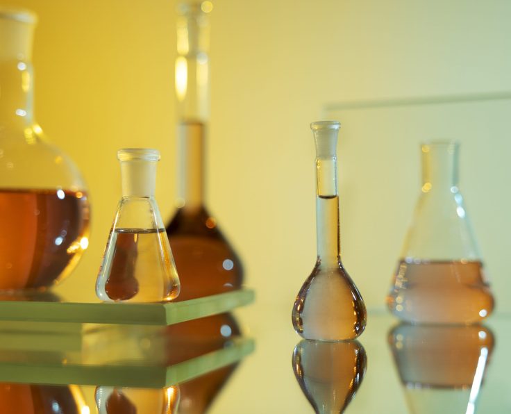 laboratory-glassware-with-orange-liquid-arrangement